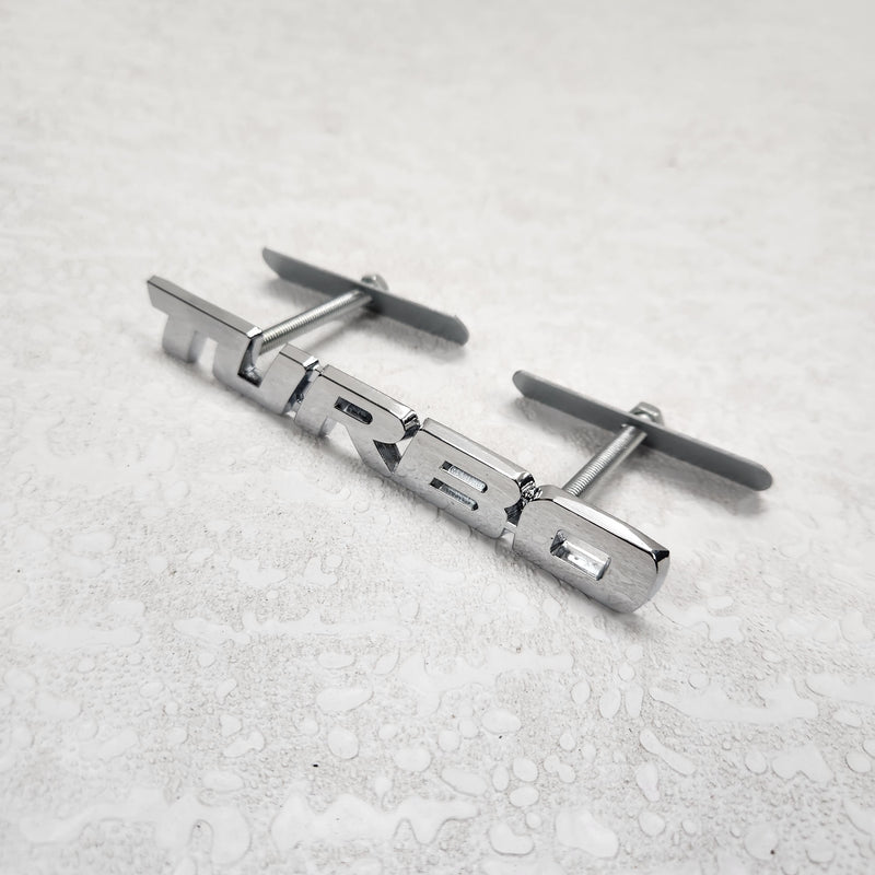 Turbo Silver Grille Metal Emblem (14.9 x 3.2 cm)