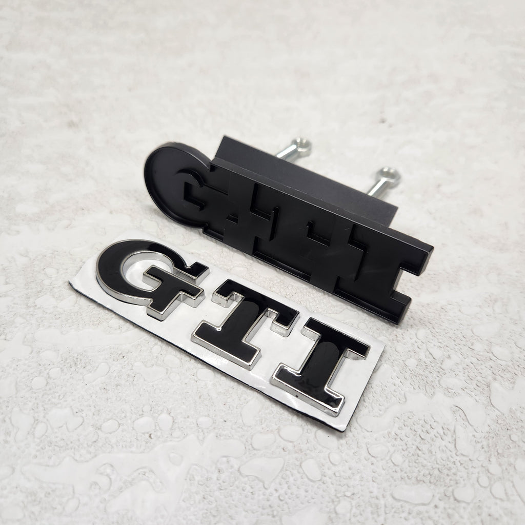 GTI Black/Silver Grille Metal Emblem (9.1 x 2.7 cm)