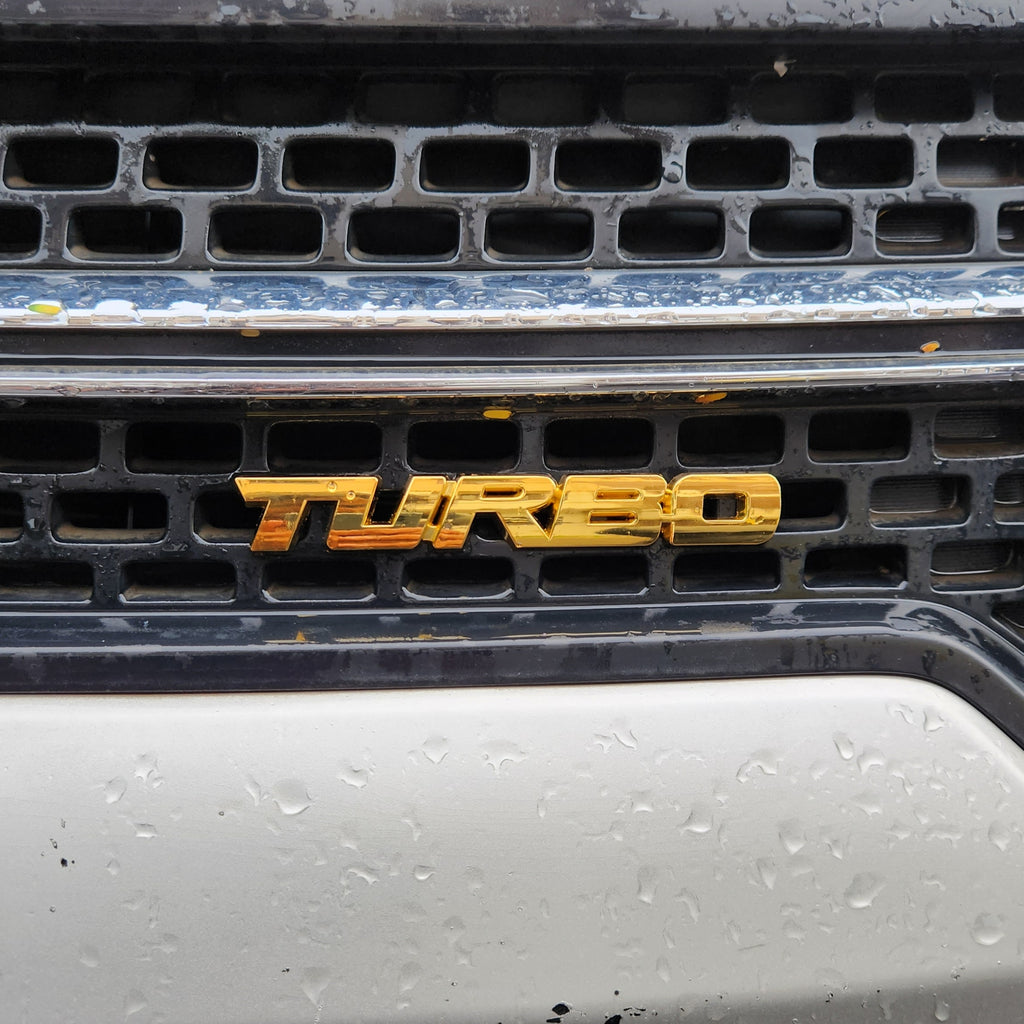 Turbo Gold Grille Metal Emblem (14.9 x 3.2 cm)
