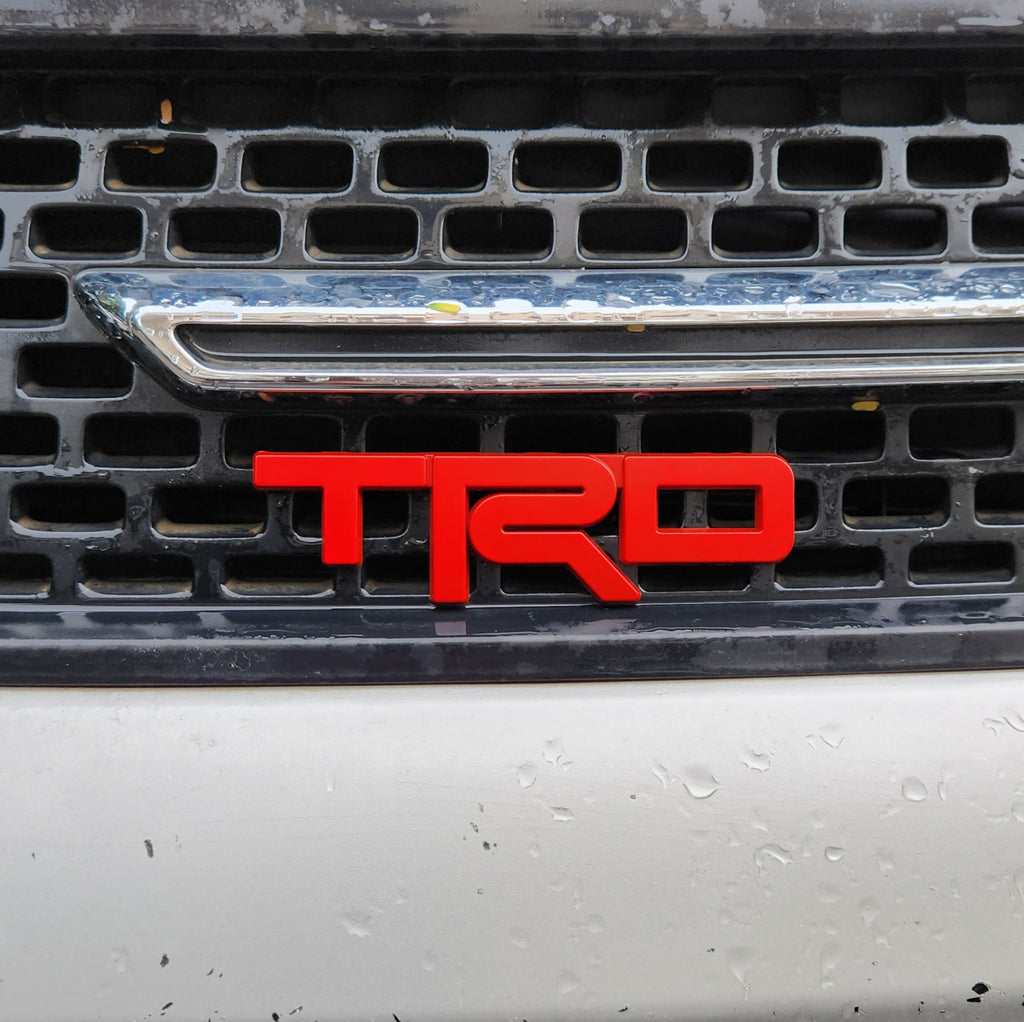 TRD Red Grille Metal Emblem (12 x 3.5 cm)